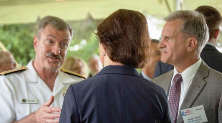 RADM Mark Darrah talking with Dr. Maija Harkonen, Executive Director of the Center for the Study of Democracy at SMCM and Roger Budd, Business Development Manager at Raytheon