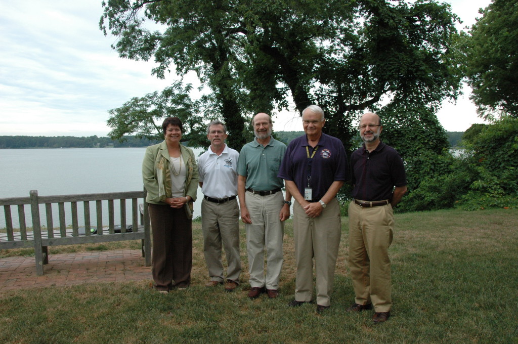 Projects by science students at St. Mary’s College of Maryland will be funded by charitable donations from the new Cove Point Natural Heritage Trust Ruth Mathes Scholarship Program. From left, Maureen Silva, vice president for advancement; Bob Boxwell, executive director of the Cove Point; Chris Tanner, biology professor; Michael Rudy, board president of the Cove Point; and St. Mary’s College President Joseph Urgo. (Photo by Lee Capristo)
