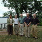Projects by science students at St. Mary’s College of Maryland will be funded by charitable donations from the new Cove Point Natural Heritage Trust Ruth Mathes Scholarship Program. From left, Maureen Silva, vice president for advancement; Bob Boxwell, executive director of the Cove Point; Chris Tanner, biology professor; Michael Rudy, board president of the Cove Point; and St. Mary’s College President Joseph Urgo. (Photo by Lee Capristo)
