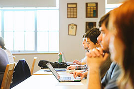 Students sitting at desk in lecture