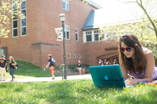 Female Student Studying Outside on the Lawn