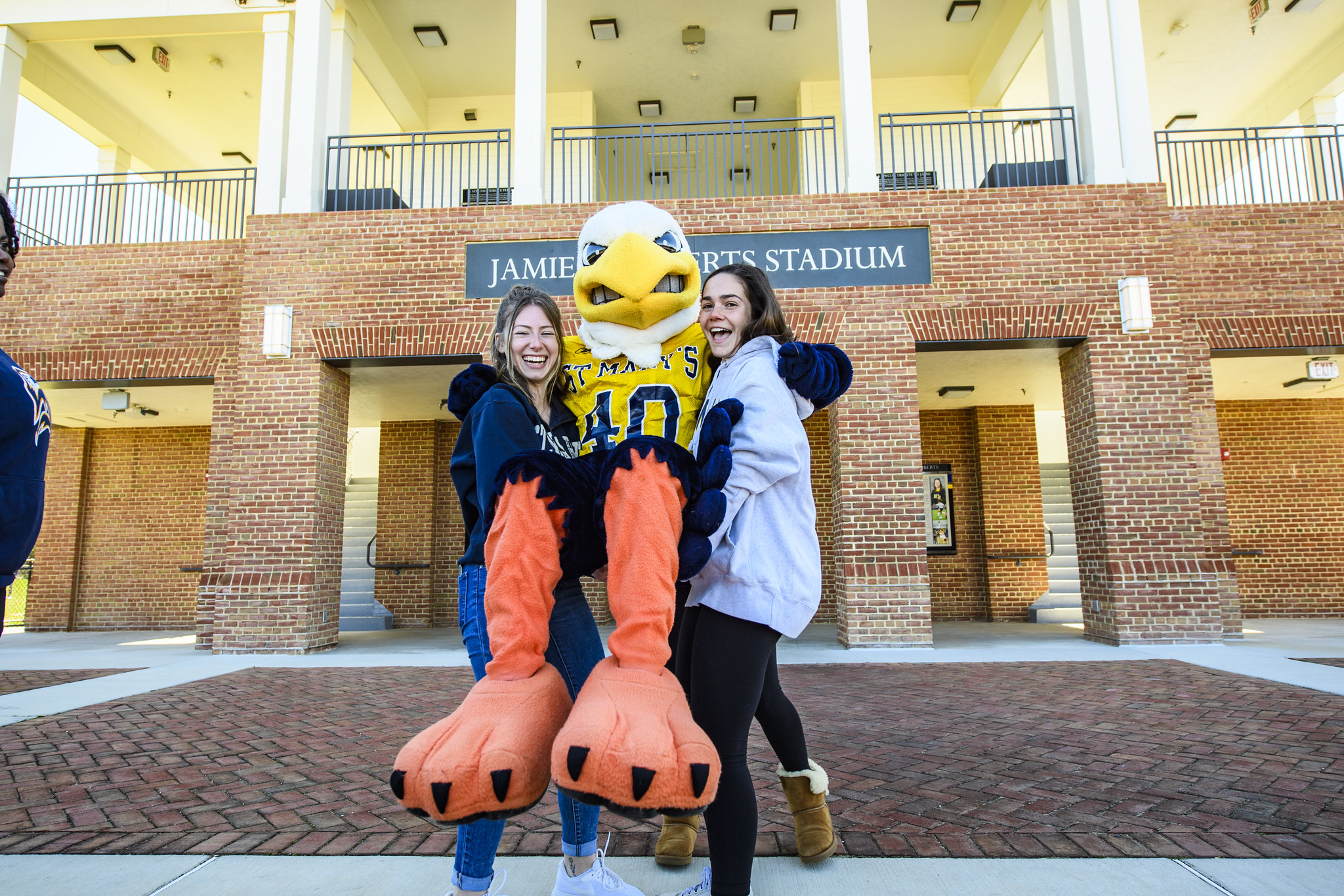 Seahawk mascot with two students