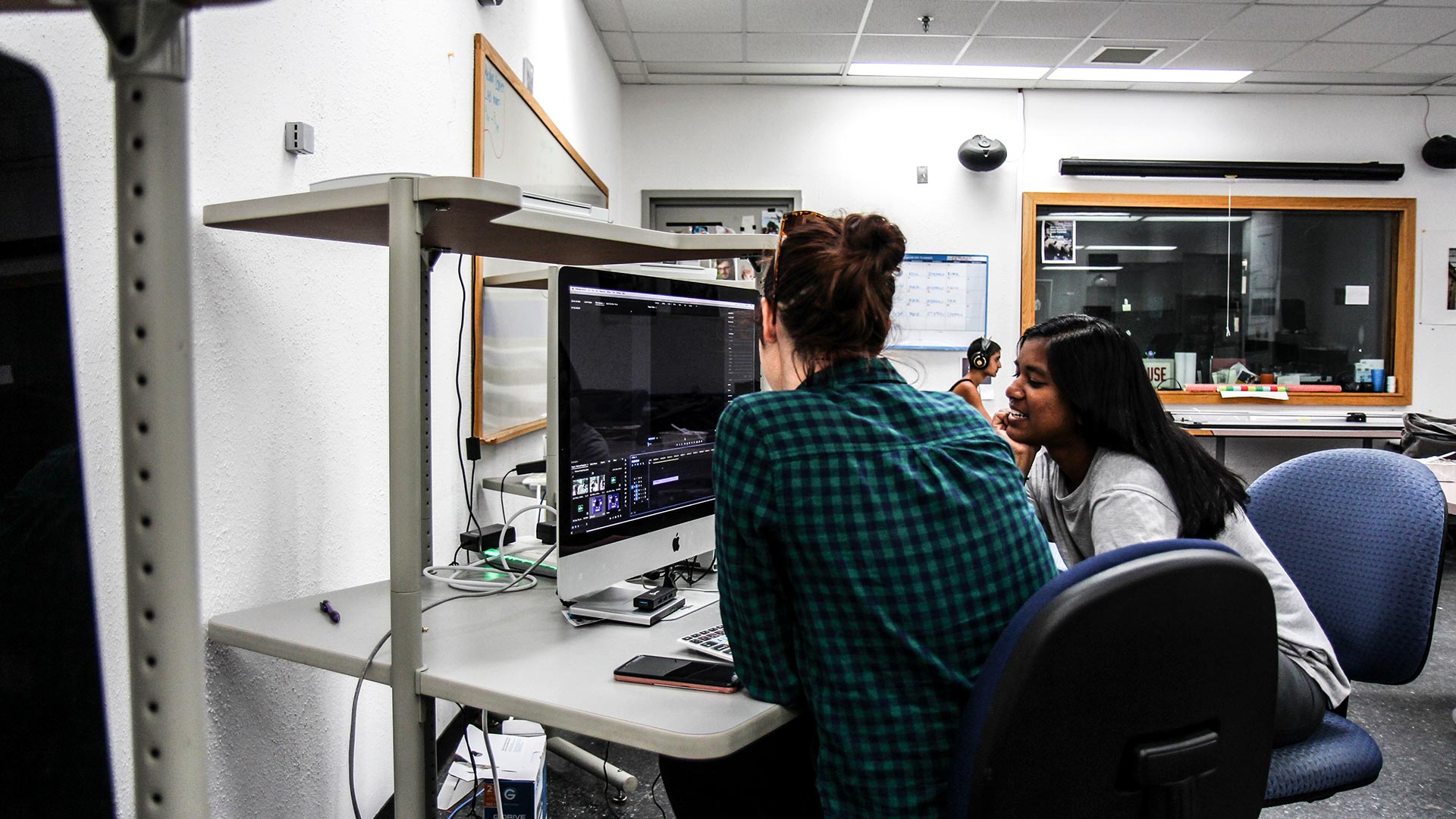 SMCM students work on an iMac video editing rig in the Media Center on the third floor of the Hilda C. Landers Library.