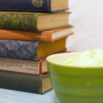 Books next to a bowl of food