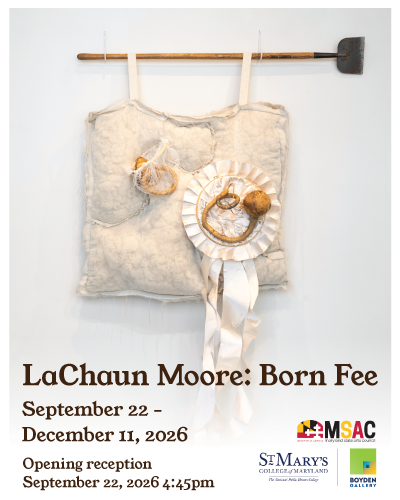 A quilted wall piece with attached objects, including dried produce and a pie tin, hangs below a hammer. Exhibition details for LaChuan Moore: Born Fee are listed below.