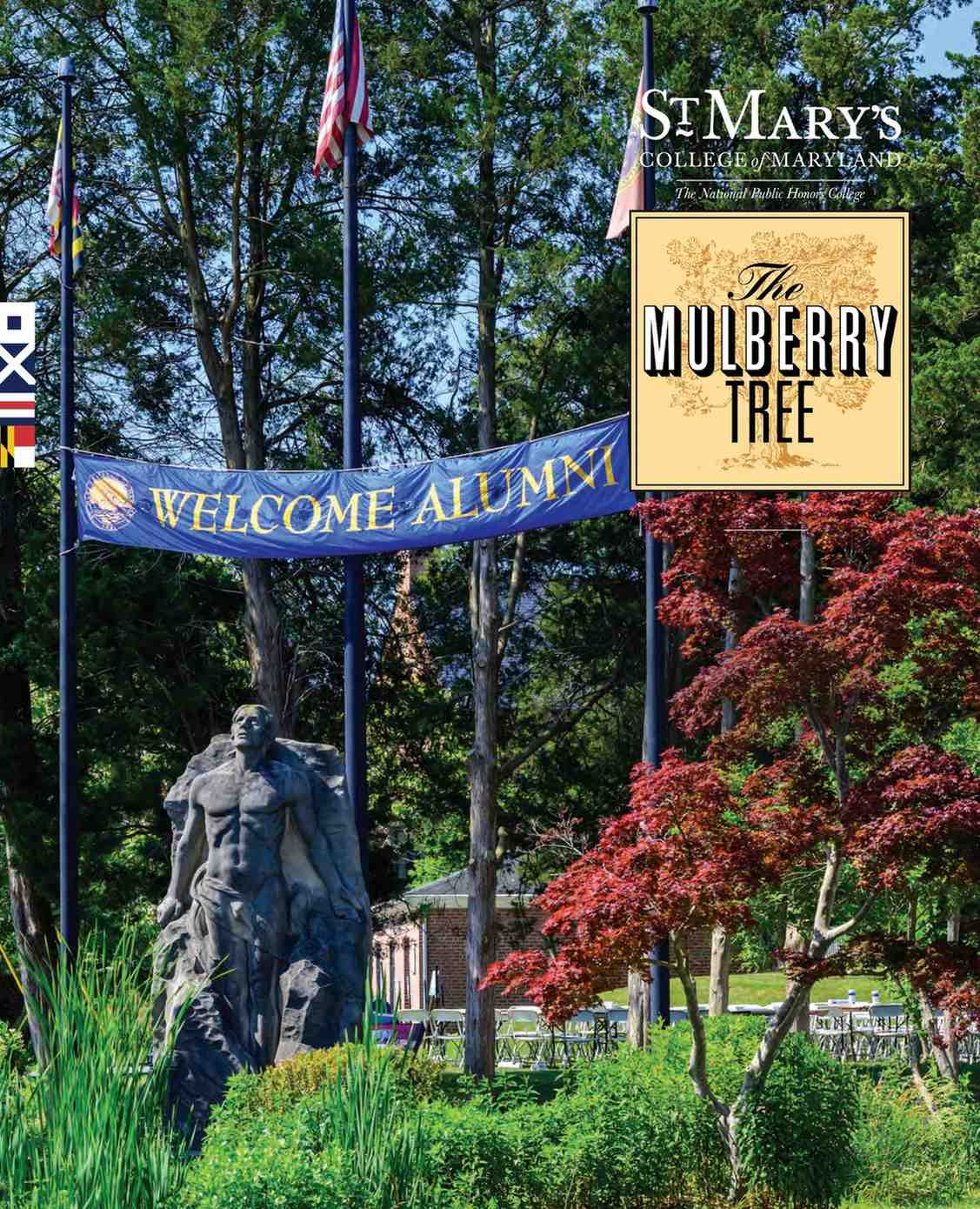 A campus statue stands in front of three flagpoles, a "Welcome Alumni" banner, and a sign reading "St. Mary's College of Maryland, The Mulberry Tree.