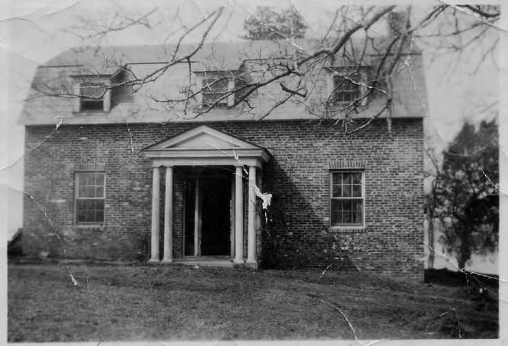 A black and white photo of the May Russell Alumni Lodge from 1927 when it was still known as the Home Ec Cottage or the Old Stable