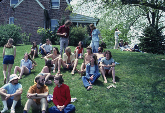 SMCM students enjoy a waterfront party on the hill below the May Russell Alumni Lodge in May 1975