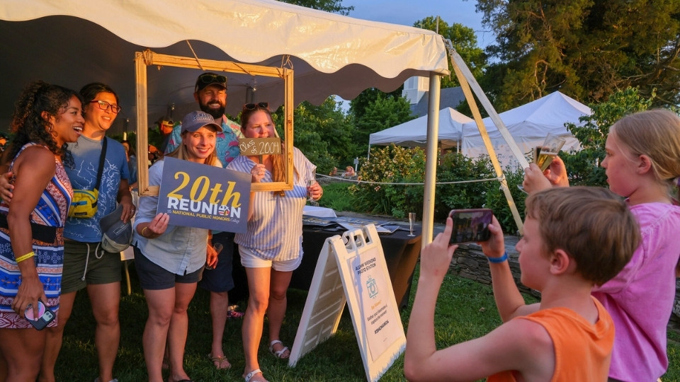 SMCM Alumni pose with classmates for their 20th at the Anniversary Dessert Reception at Alumni Weekend