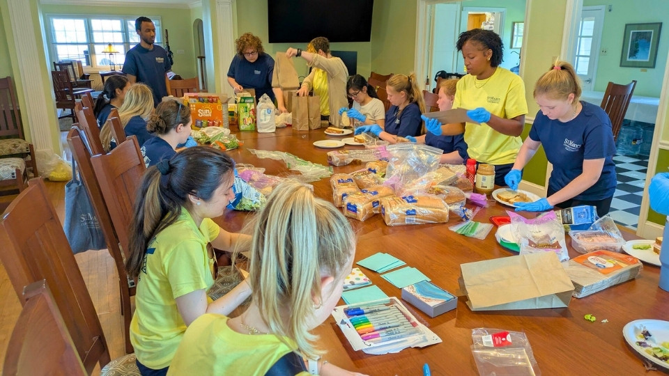 Bay to Bay Service Day Lunches for HOPE, all together at the big table