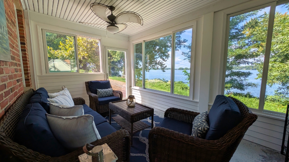 The May Russell Alumni Lodge back porch left side facing the water.