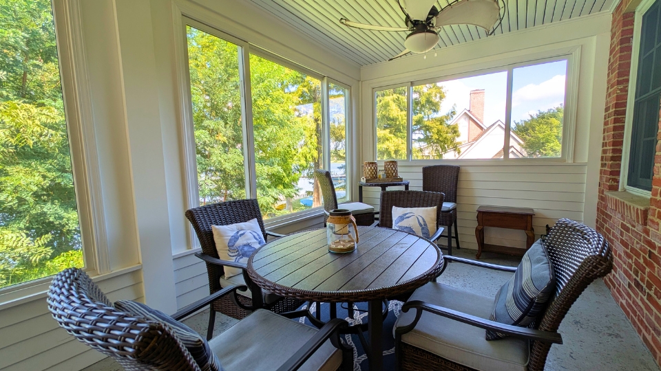 The May Russell Alumni Lodge back porch right side facing the water.