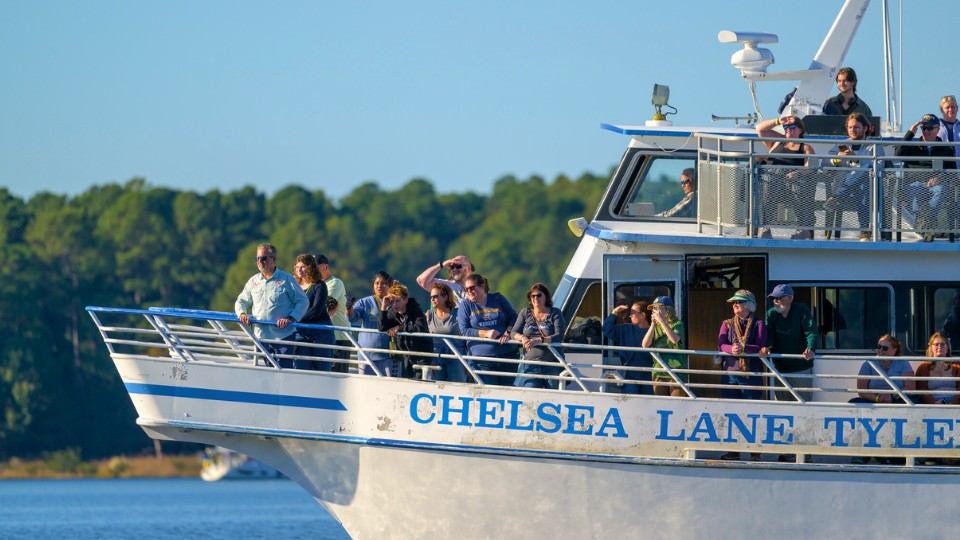 Hawktoberfest attendees enjoy a river cruise aboard the Chelsea Lane Tyler boat