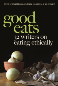 Book cover for "Good Eats: 32 Writers on Eating Ethically" with onions, garlic, and a brown paper bag on a dark surface.