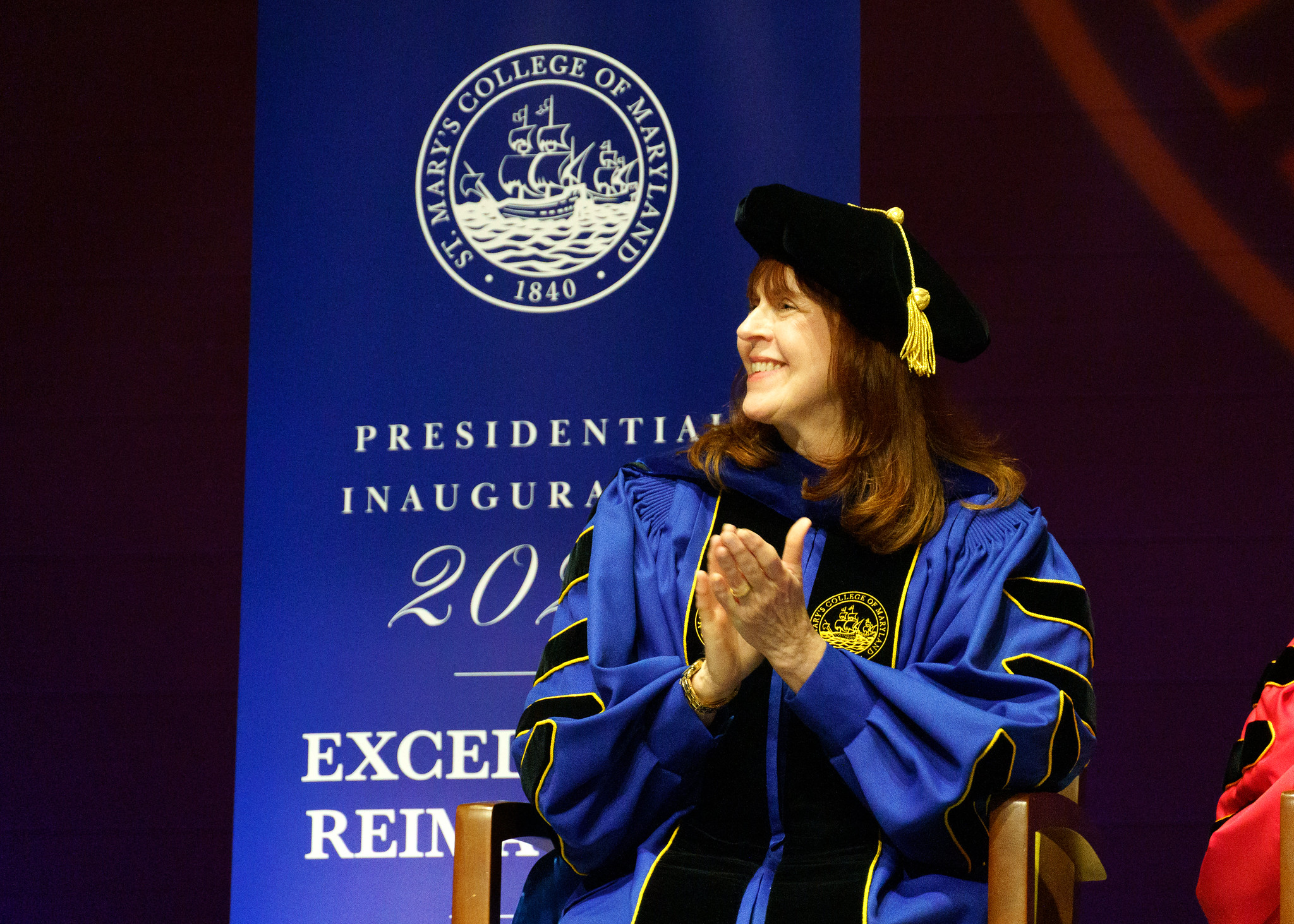 President Rhonda Phillips sites in her St. Mary's College of Maryland regalia at her Inauguration in April 2026.