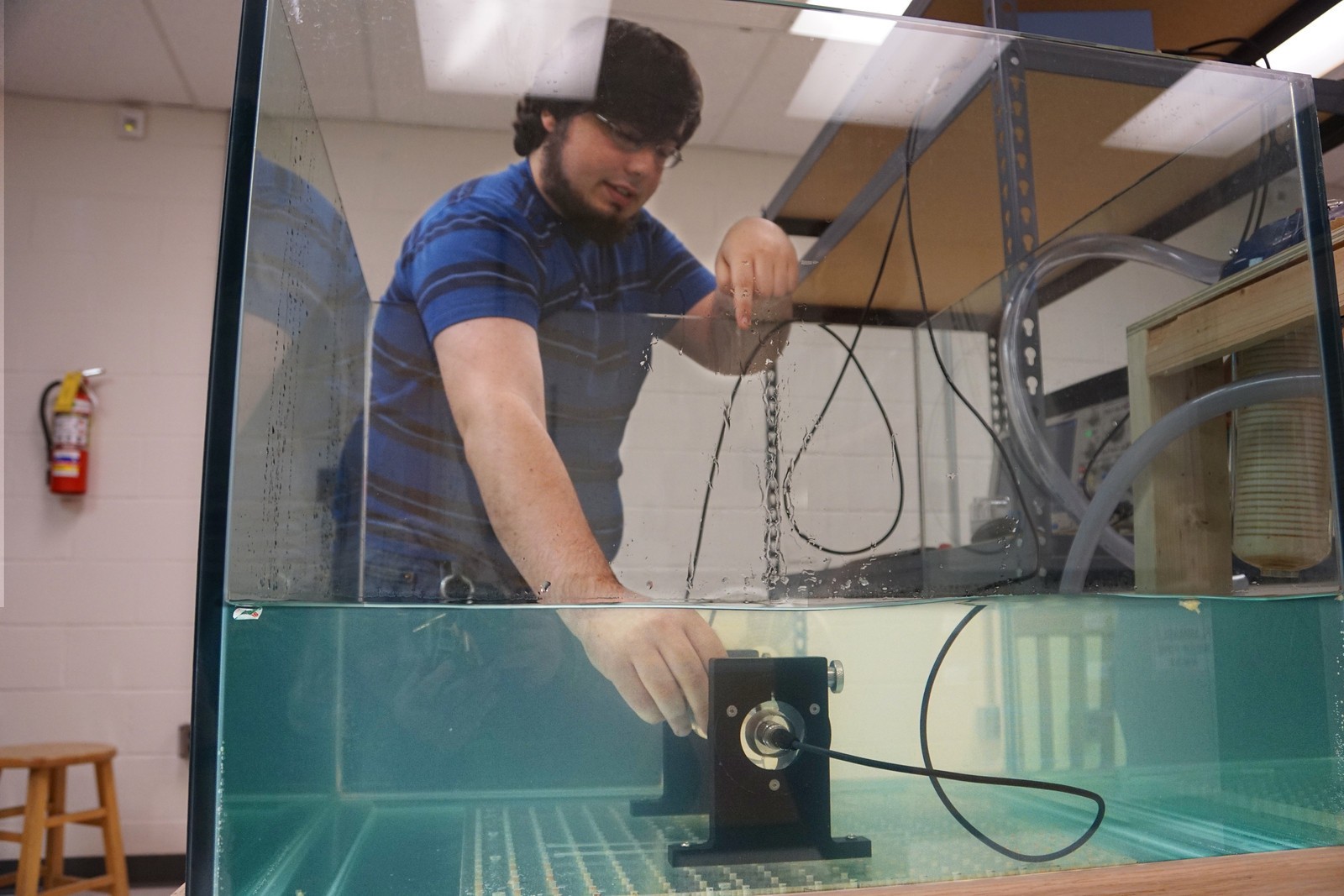 student adjusts ultrasound