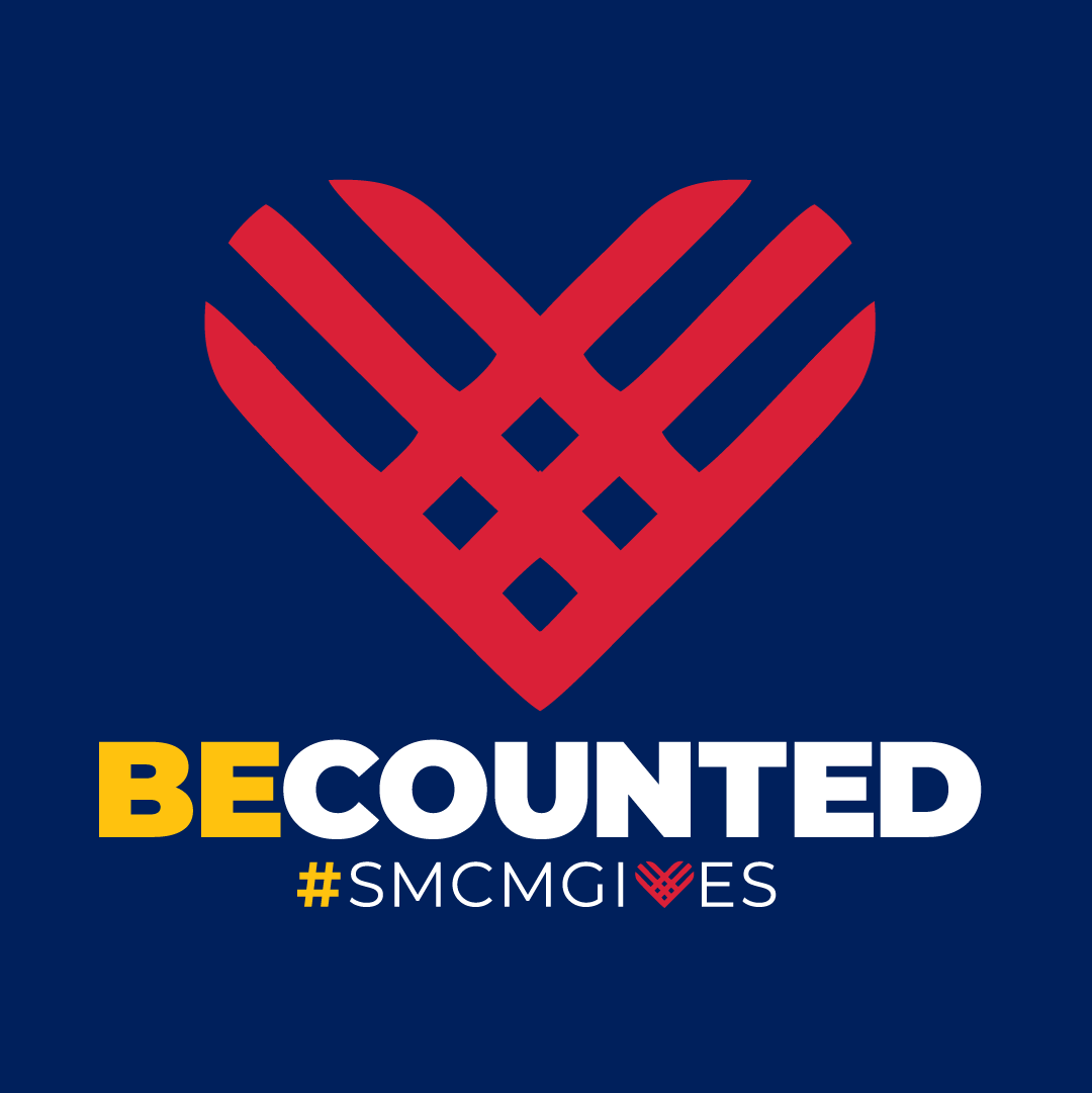 A red heart-shaped graphic above the words "BE COUNTED #SMCMGIVES" on a dark blue background.