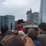 Dylan filming in a crowded street in the London Study Tour