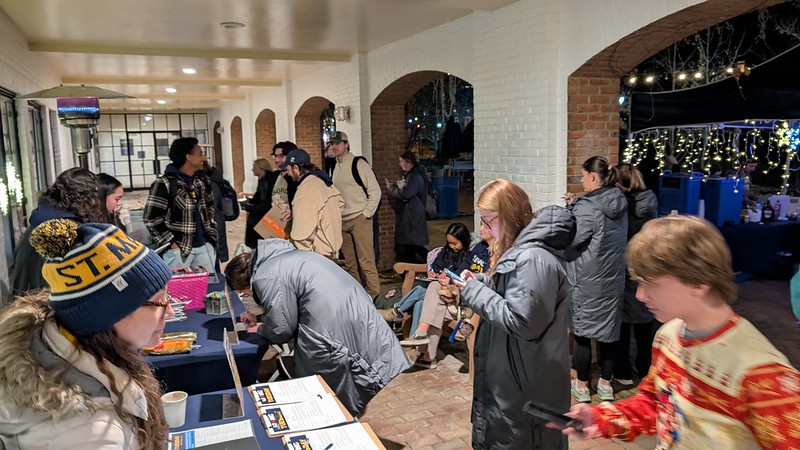 Giving Tuesday 2024, The Allan Challenge on the Campus Center patio at night.
