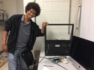 Dan Hunt '19 displays instrumentation he is constructing for the SMCM radio telescope.