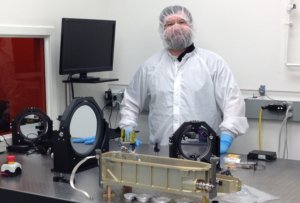 Paul Stysley in clean suit with laser