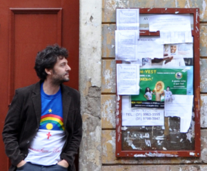 Filmmaker Charles Bicahlo, pictured here leaning against a red door on an old pedestrian street, will feature his short films at the St. Mary's College 11th Annual Film Festival