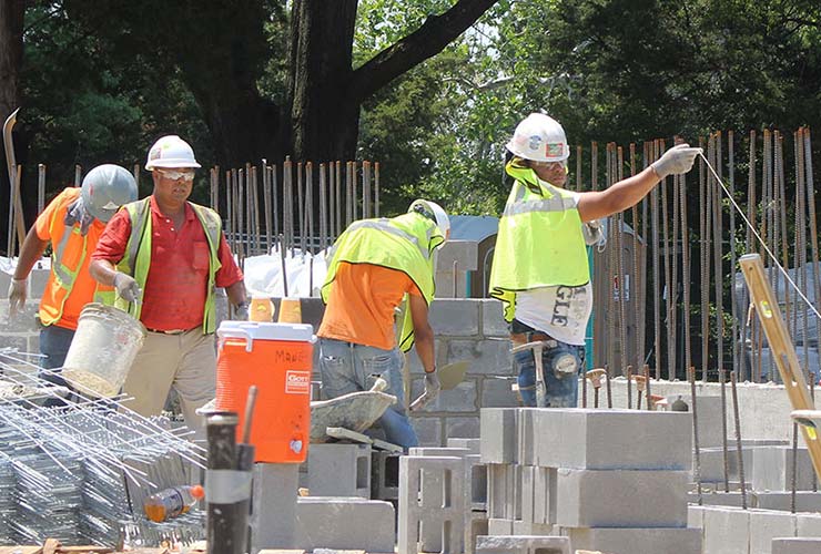 Construction crew working concrete , block and rebar in the Anne Arundel construction site