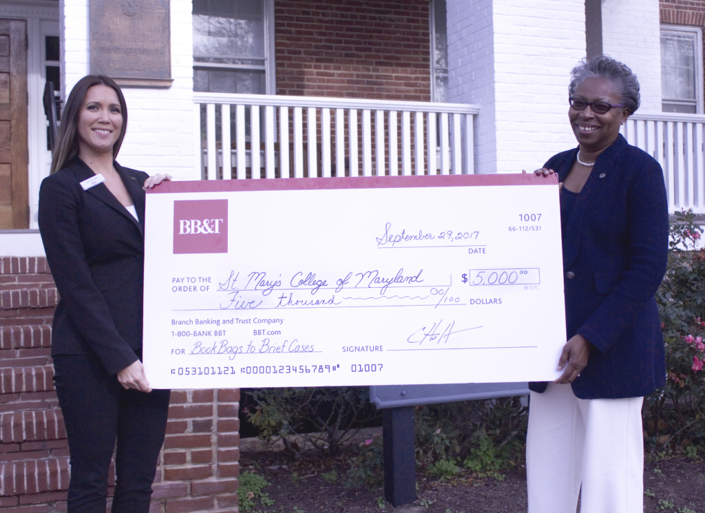 Tuajuanda C. Jordan, president of St. Mary’s College of Maryland (right), accepts a check for the Bookbag to Briefcase program from BB&T. The check was presented by Elizabeth Snyder, vice president at BB&T, St. Mary’s County region.