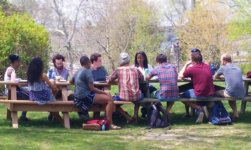 Spring weather often finds philosophy classes being taught outdoors.