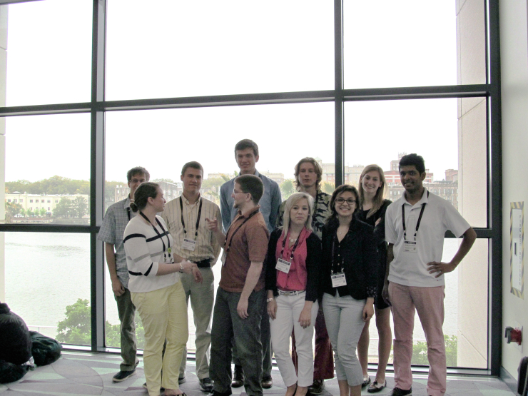 Physics students stand in a group