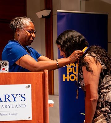 President Jordan presents College medallion to Margaret Brent Lecturer Isa Noyola
