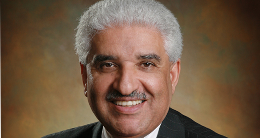 Image of Amir Mohammadi on a soft tan and black background