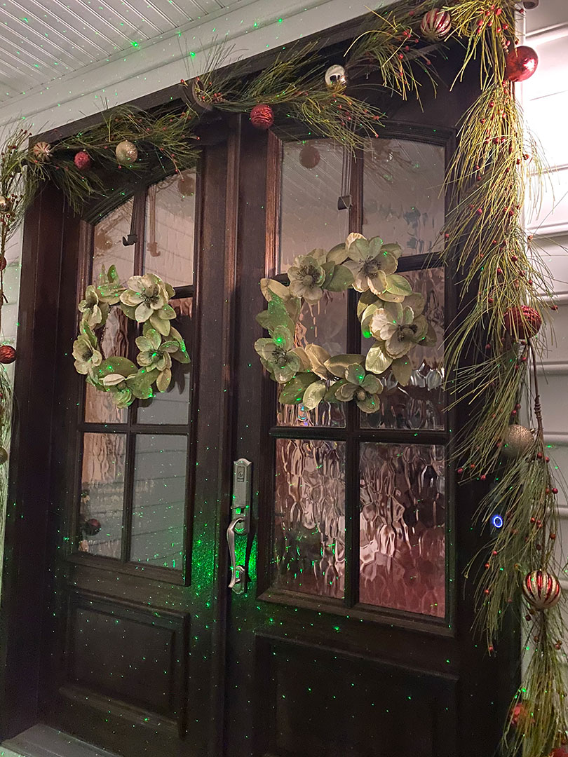 Shannon Jarboe - Doorway decorated with garlands, wreaths, and ornaments