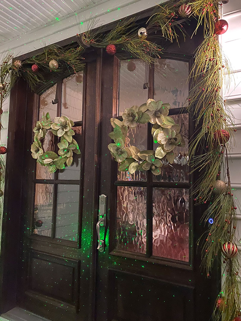 Shannon Jarboe - Doorway decorated with garlands, wreaths, and ornaments Shannon Jarboe - Doorway decorated with garlands, wreaths, and ornaments