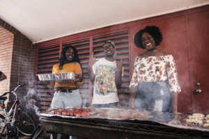 Three students cooking together