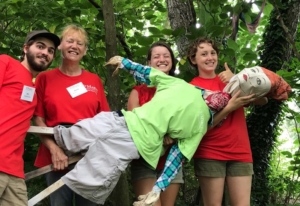 Campus Farm volunteers with scarecrow