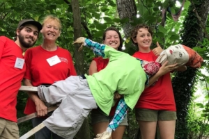 Campus Farm volunteers with scarecrow