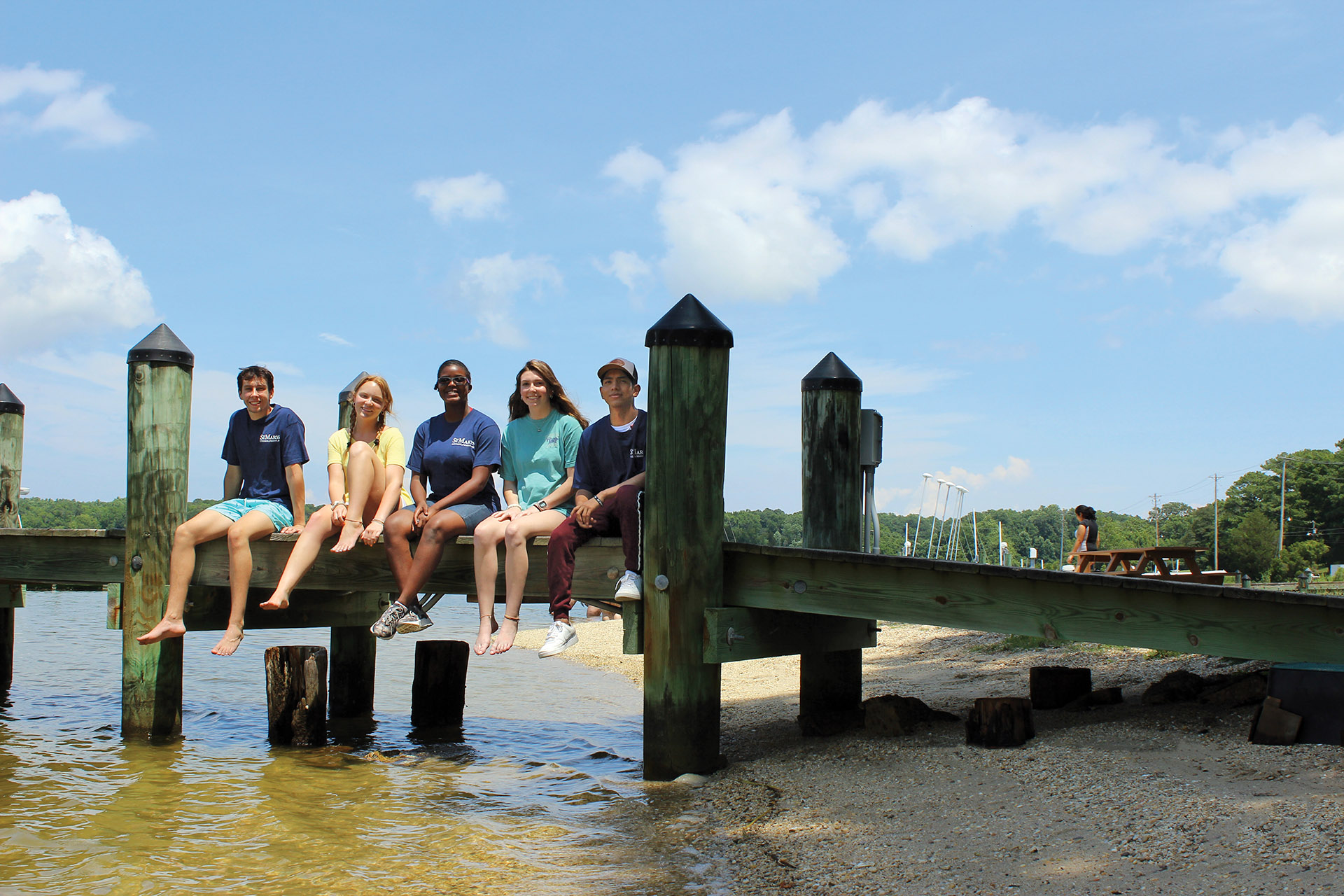 St. Mary's College of Maryland students sit at the docks